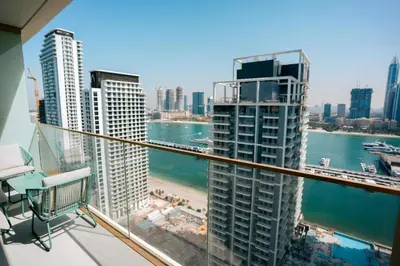 a view from the balcony of a building at Cozy Apartment with Private Beach & Palm Views in Dubai