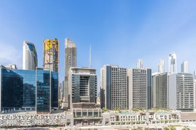 a view of a city with tall buildings at RH - Burj Khalifa view with large balcony, 02BR retreat in business bay in Dubai