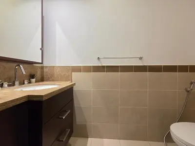 a bathroom with a sink and a toilet at Vacay Lettings 1 bed with burj Khalifa View in Dubai