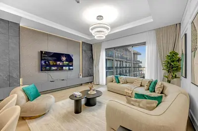 a living room with two couches and a tv at Gym, Spa & Sauna, Pool, Tenis Court, Dishwasher, 2BR in Central Park in Dubai