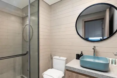 a bathroom with a sink and a mirror at Modern Studio Canal & Pool View Business Bay in Dubai