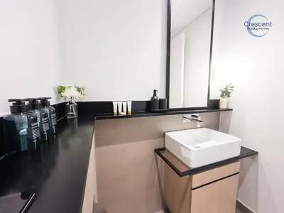 a bathroom with a sink and a mirror at Premium 1 Bedroom Stay in Berkeley Place in Dubai