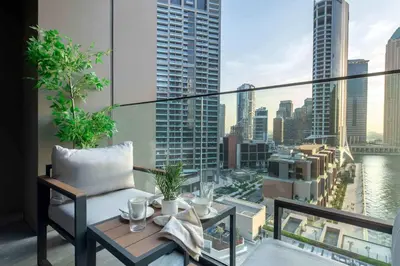 a balcony with a view of a city skyline at Frank Porter - Peninsula One in Dubai