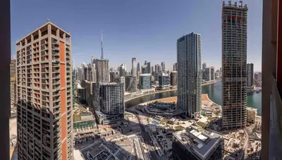 an aerial view of a city with tall buildings at Frank Porter - Peninsula One in Dubai