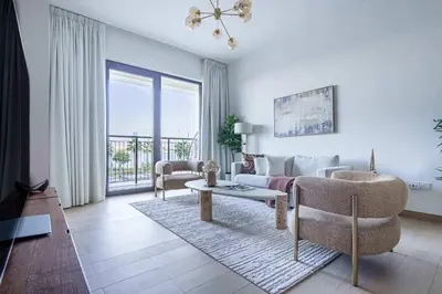 a living room with a couch and a table at Frank Porter - La Voile in Dubai