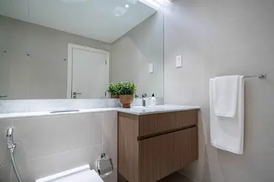 a bathroom with a sink and a mirror at Frank Porter - La Voile in Dubai