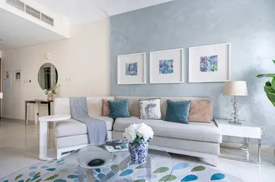 a living room with a couch and a table at Frank Porter - The Signature in Dubai
