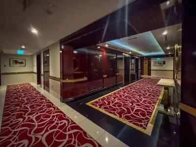 a hallway with a red carpet in a building at Frank Porter - The Signature in Dubai
