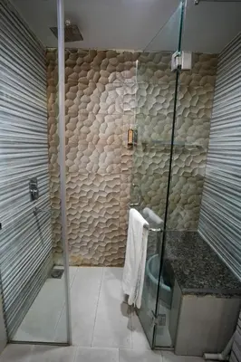 a bathroom with a shower with a glass door at Sea View Luxe Room Marina Dubai in Dubai