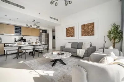 a living room with a couch and a table at Burj Khalifa Doorstep Stunning 2BR Apartment in Dubai