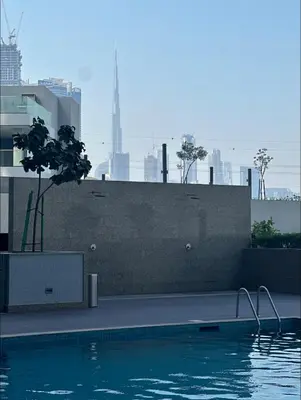 a swimming pool on the side of a building at Holiday heaven specious one bed room apartment near Dubai mall with burj khalifa view in Dubai