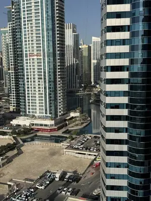 a view of a city with tall buildings at Aesthetic Feel with Lake View in Dubai