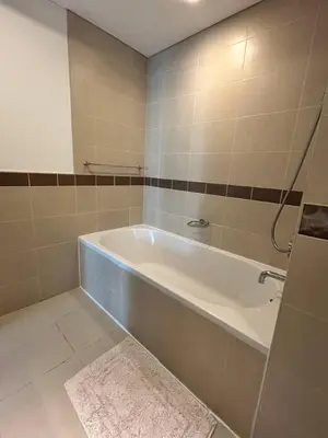 a bathroom with a bath tub in a room at Luxurious 1Bedroom Apt in 29 Boulevard - Downtown in Dubai