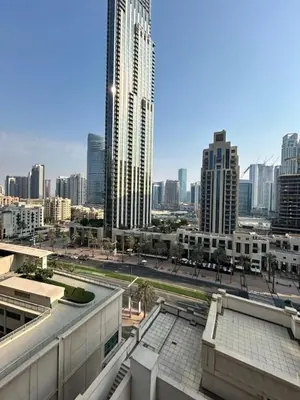 a view of a city skyline with tall buildings at Luxurious 1Bedroom Apt in 29 Boulevard - Downtown in Dubai