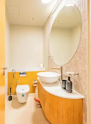 a bathroom with a sink and a mirror at Stylish Two-BHK Apartment - Iris Blue, Marsa Dubai in Dubai