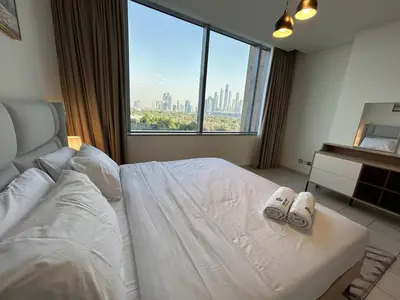 a bedroom with a bed with two slippers on it at Luxury 2-Bedroom Apartment in DIFC in Dubai