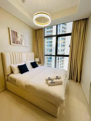 a bedroom with a large bed with a large window at Modern 2bhk Apartment with Stunning City Views in Dubai