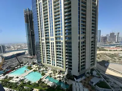 an aerial view of a large apartment building with a pool at Modern 2bhk Apartment with Stunning City Views in Dubai