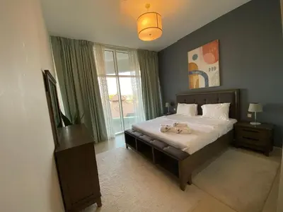 a bedroom with a bed with two stuffed animals on it at Entire House in Palm Jumeriah with a Sea View in Dubai