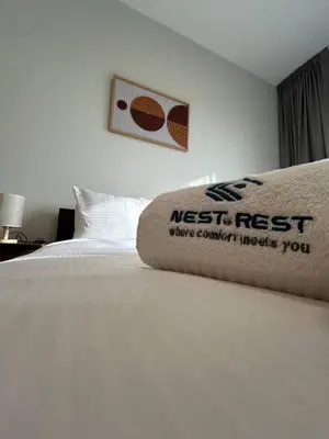 a bedroom with a bed with a nest next sign on it at Modern Studio Apt in Jabel Ali Near Metro in Dubai