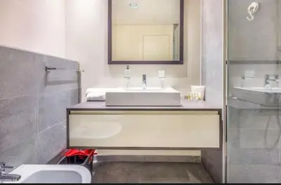 a bathroom with a sink and a mirror at Luxurious cozy studio in Dubai