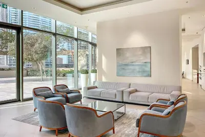a living room with a couch and chairs and a table at Downtown Luxury Two Bedroom Apartment I Conntected To Dubai Mall And Metro I Steps Away From Burj Khalifa I by Luxury Space in Dubai