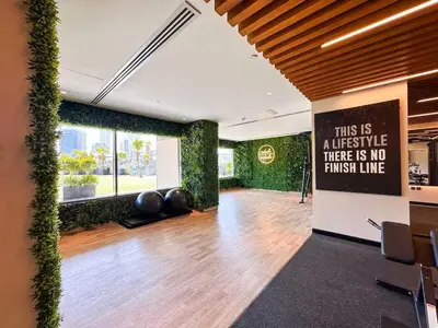 a large room with plants on the walls at Elite Downtown Residence1 Lake View And Burj view 1 bedroom in Dubai