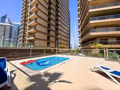 a swimming pool in the middle of a building at Elite Downtown Residence1 Lake View And Burj view 1 bedroom in Dubai