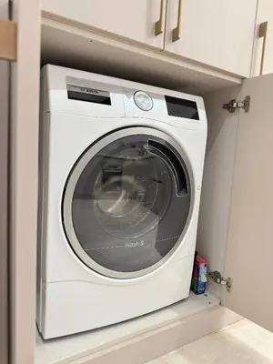 a white washing machine sitting in a kitchen at Unique Sea View 1BDR Apartment | Anantara Palm in Dubai
