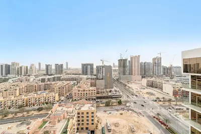 an aerial view of a city with tall buildings at VayK - Bright and Modern One Bedroom in JVC in Dubai