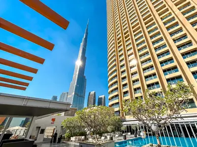a view of the burj khalifa from the city at Luxurious 1 BR Apt Kempinski Central Avenue in Dubai