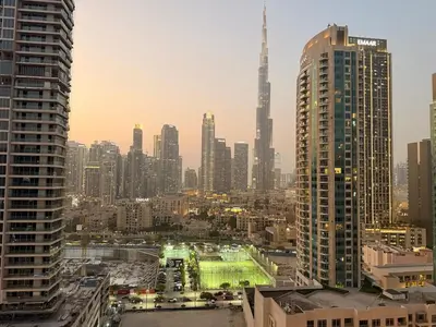 a view of a city skyline with tall buildings at 2 BR with Full Burj View 10 min Walk to Dubai Mall in Dubai
