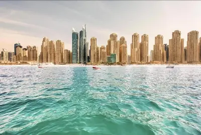 a view of a city from the water with buildings at Royal Marina Inn in Dubai