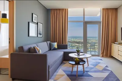 a living room with a couch and a table at A luxurious 1 bedroom and living room in Dubai