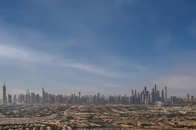 a view of a city with a bunch of tall buildings at A luxurious 1 bedroom and living room in Dubai
