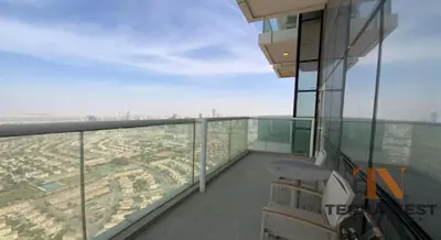 a balcony of a building with a view of a city at A luxurious 1 bedroom and living room in Dubai