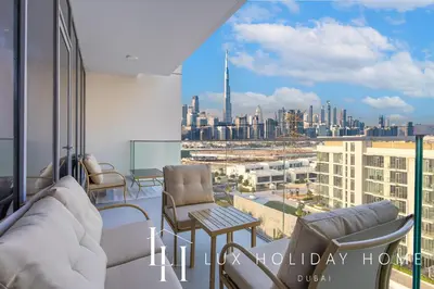 a living room with a view of the city at LUX The Burj Khalifa Lagoon View Suite 5 in Dubai