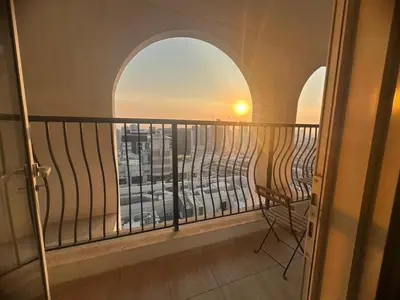 a balcony with a view of a city at Burj Sabah in Dubai