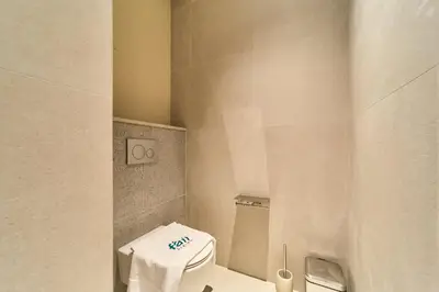 a bathroom with a toilet with a towel on it at Iconic 2BR Vida Dubai Mall with Direct Mall Access in Dubai