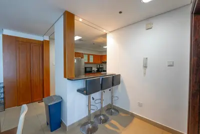 a kitchen with a sink and a counter top at Modern 1 BHK Retreat in Lakeside JLT in Dubai