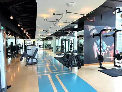 a gym with treadmills and exercise equipment in a building at Dubai Marina Luxury 1 BDR Holiday Apartment - Dubai Marina Walk in Dubai