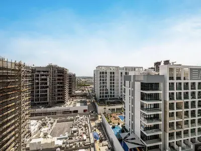 an overhead view of a city with tall buildings at Livin' Holidays - Studio - Azizi Elegant Studio in Dubai