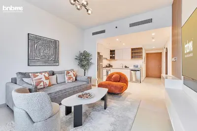 a living room with a couch and chairs and a table at bnbmehomes - Downtown Views II - Tower 1 in Dubai