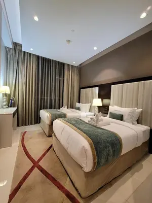 a hotel room with two beds in a room at Downtown Dubai Burj Khalifa View 2 BHK Dubai Mall in Dubai