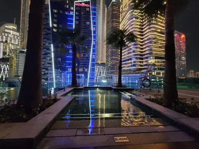 a view of a city at night with tall buildings at Downtown Dubai Burj Khalifa View 2 BHK Dubai Mall in Dubai