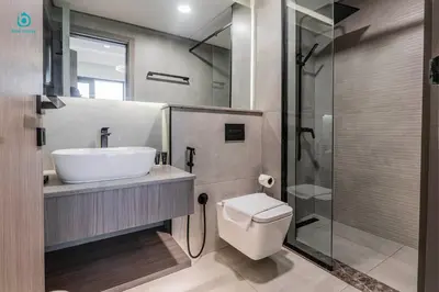a bathroom with a sink and a toilet and a shower at Blue Breeze - Stylish 1 BR in JVC Al Serh Residence in Dubai