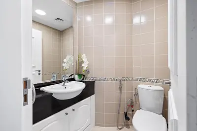 a bathroom with a toilet and a sink at Ultra-Luxury Penthouse Private Pool & Yacht Views in Dubai