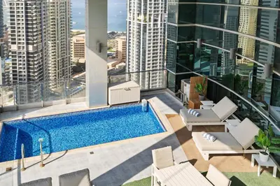 an apartment with a swimming pool on the roof of a building at Ultra-Luxury Penthouse Private Pool & Yacht Views in Dubai