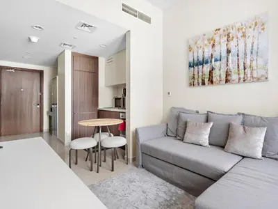 a living room with a couch and a table at Executive 1BDR Sleeps 4 In Vera-Business Bay-80 in Dubai