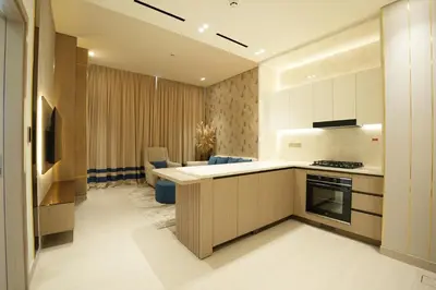 a kitchen with a counter and a stove top oven at OLD The Royal Blue Jacuzzi Suite 3501 in Dubai